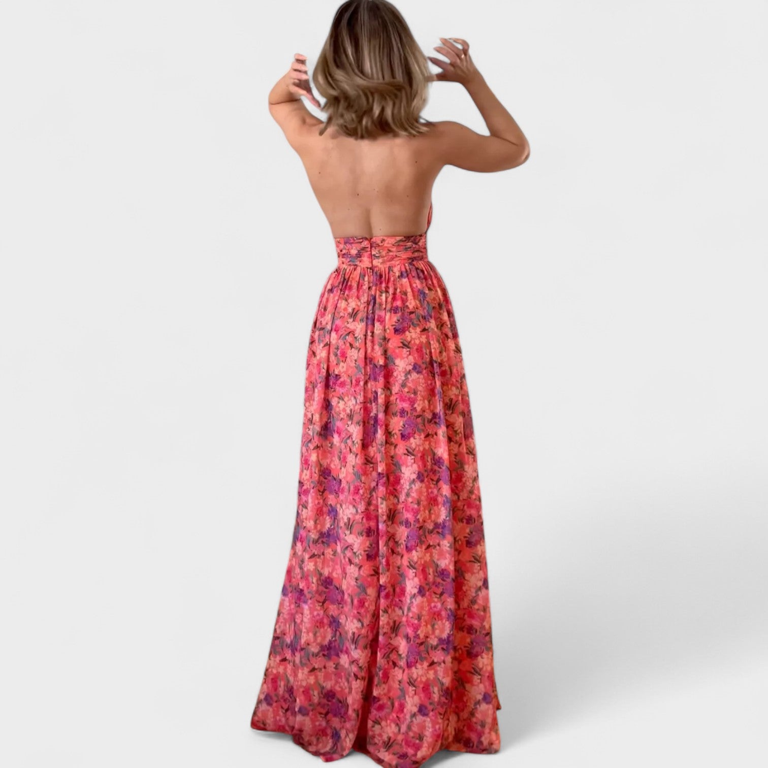 Floraria – Abito lungo halter floreale con schiena scoperta